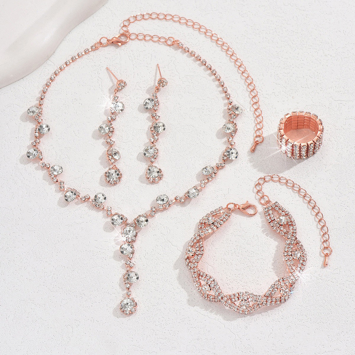 Braided bracelet and rhinestone ring set of four