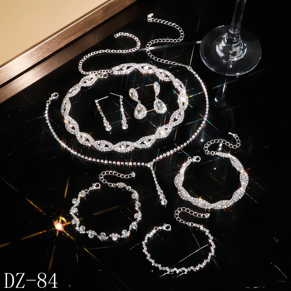 Braided bracelet and rhinestone ring set of four