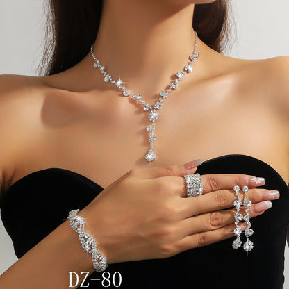 Braided bracelet and rhinestone ring set of four