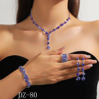 Braided bracelet and rhinestone ring set of four