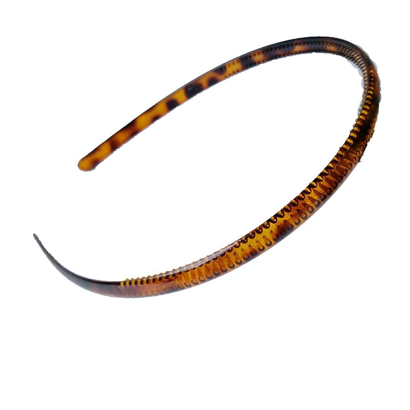 Plastic toothed non-slip headband