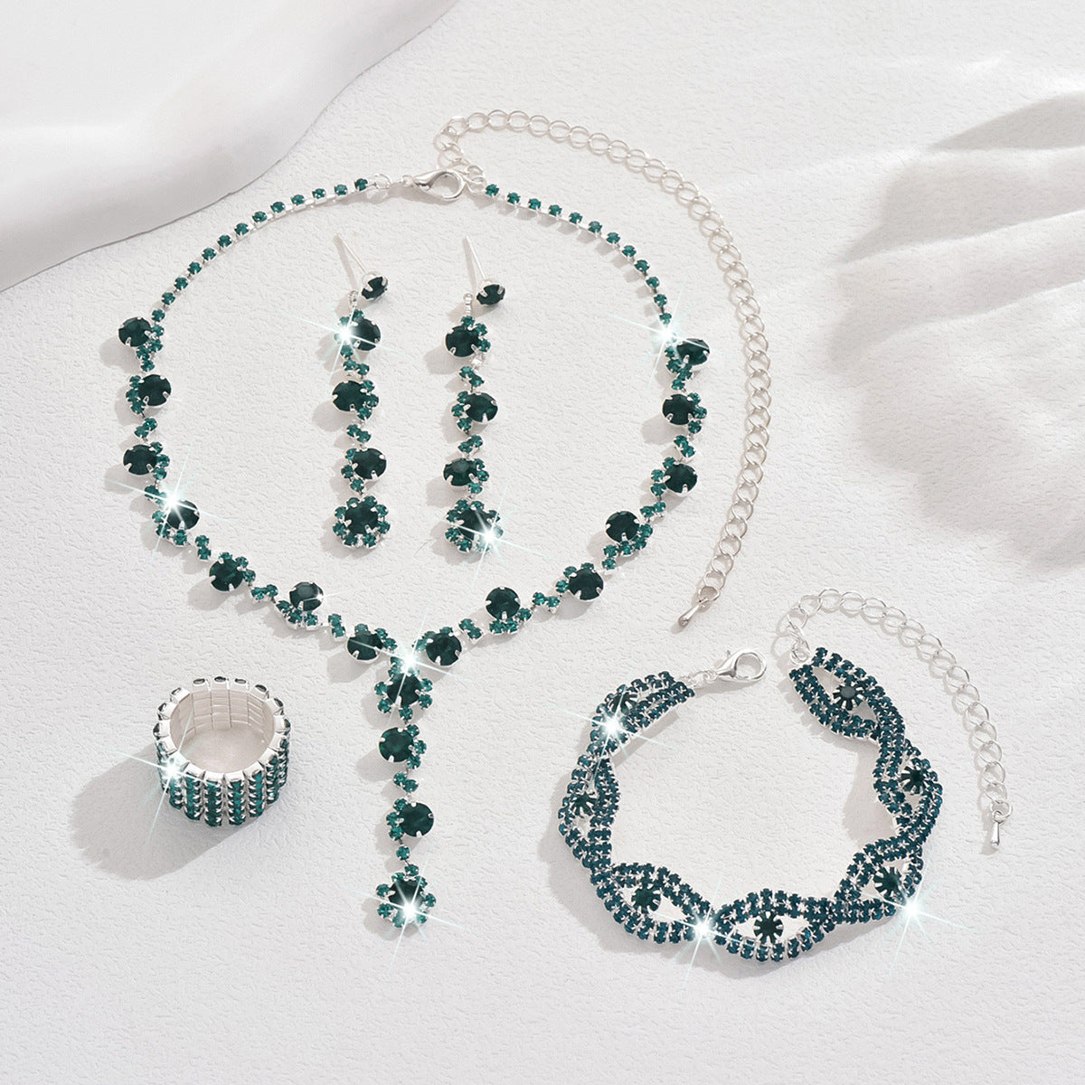 Braided bracelet and rhinestone ring set of four