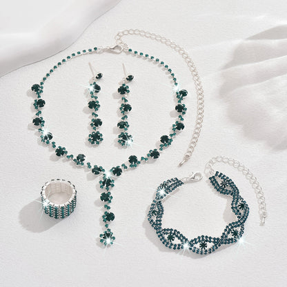 Braided bracelet and rhinestone ring set of four