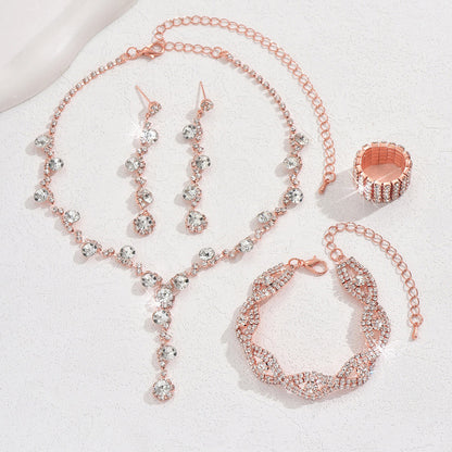 Braided bracelet and rhinestone ring set of four
