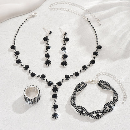 Braided bracelet and rhinestone ring set of four