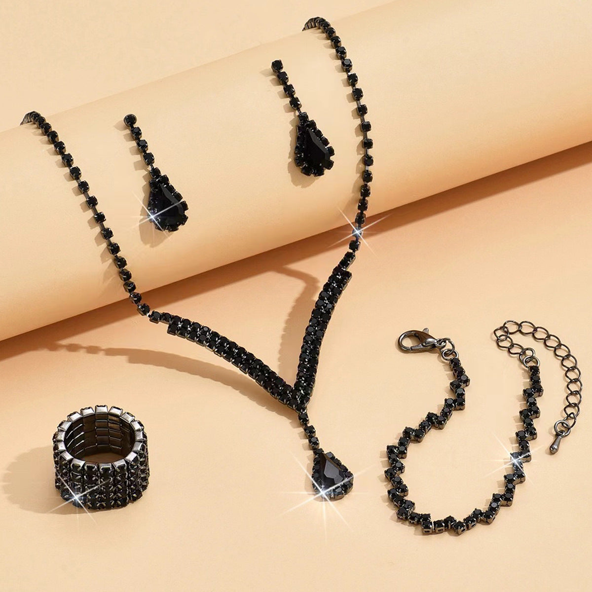 Braided bracelet and rhinestone ring set of four