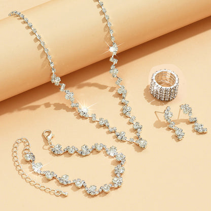 Braided bracelet and rhinestone ring set of four