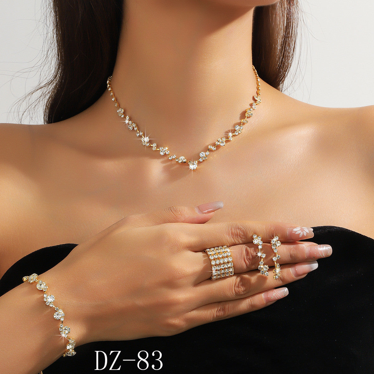 Braided bracelet and rhinestone ring set of four