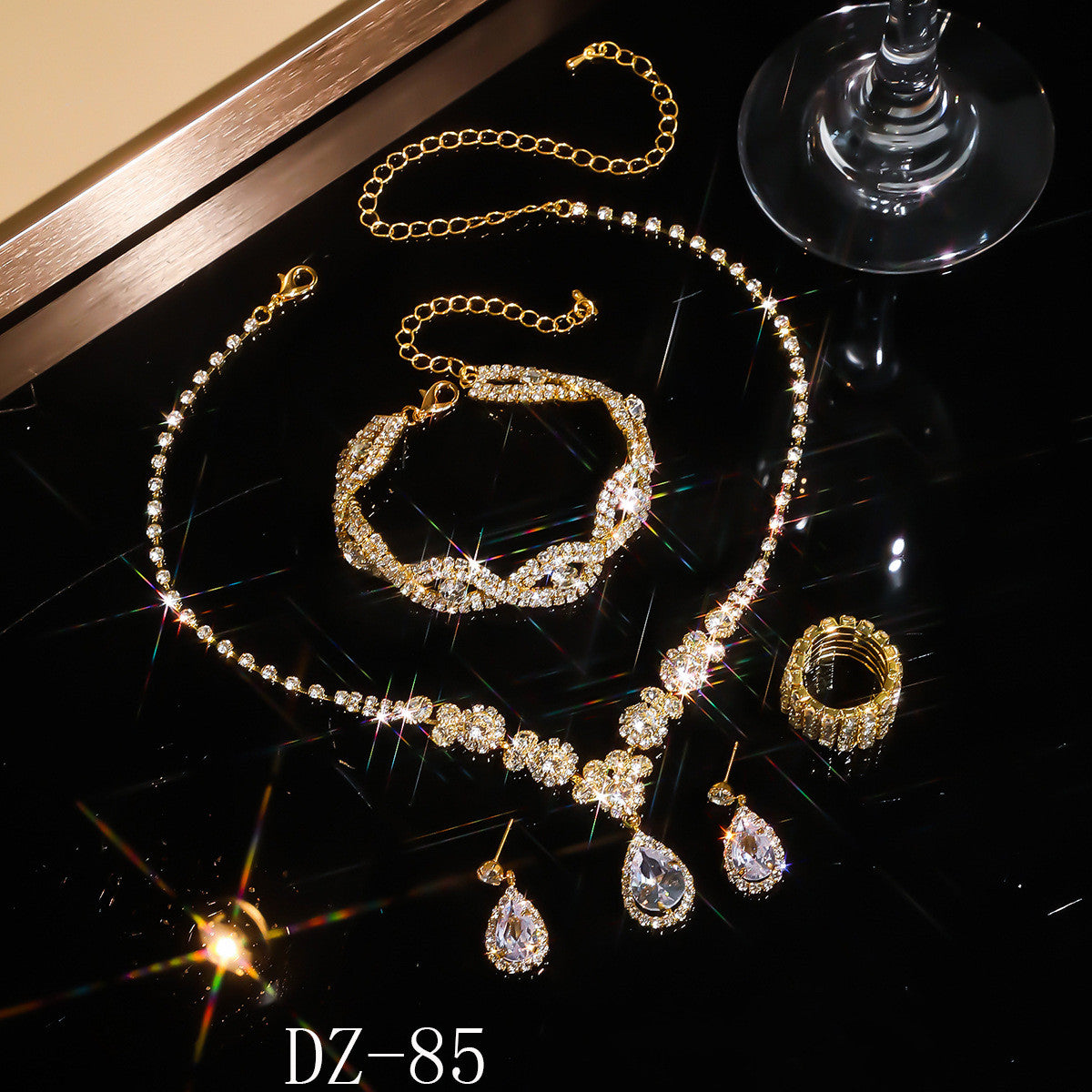 Braided bracelet and rhinestone ring set of four