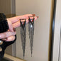 European and American popular diamond-encrusted metal long tassel earrings for women, high-end earrings with niche temperament